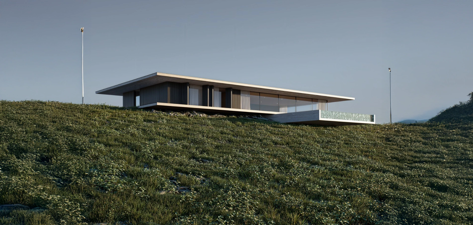 Residência contemporânea de linhas horizontais sobre uma encosta verde